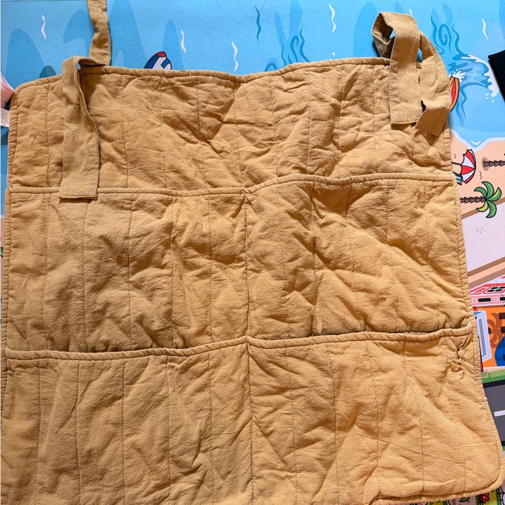 Yellow Quilted hanging organizer for baby room